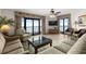Inviting living area with balcony access, plush seating, and beautiful ocean views at 5310 N Ocean Blvd. # Ph 6 1506, Myrtle Beach, SC 29577