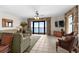 Comfortable living room features stylish furnishings, ocean views and balcony access at 5310 N Ocean Blvd. # Ph 6 1506, Myrtle Beach, SC 29577