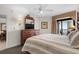 Bright main bedroom featuring a balcony, ceiling fan, and warm, neutral tones at 5310 N Ocean Blvd. # Ph 6 1506, Myrtle Beach, SC 29577