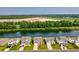 An aerial perspective reveals homes nestled beside a tranquil body of water and vast landscapes at 560 Pier Ct., Longs, SC 29568
