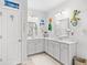 Bright bathroom featuring double sinks, white cabinetry, and decorative accents at 560 Pier Ct., Longs, SC 29568