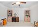 Bright bedroom featuring bookcases, ceiling fan, and decorative lamp at 560 Pier Ct., Longs, SC 29568