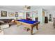 Spacious game room with a pool table, leather sofa, and modern decor at 560 Pier Ct., Longs, SC 29568