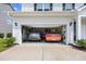 Two-car garage with ample space for parking and storage at 560 Pier Ct., Longs, SC 29568