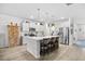 Well-lit kitchen featuring a large island with seating, stainless steel appliances, and plenty of cabinet space at 560 Pier Ct., Longs, SC 29568