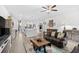 Open living area with wood floors, modern furnishings, and ample natural light at 560 Pier Ct., Longs, SC 29568
