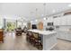 Spacious open-concept design integrates the kitchen, living room, and outdoor patio for seamless entertaining at 560 Pier Ct., Longs, SC 29568