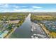 Scenic aerial view of a waterway with a marina, surrounding trees, and buildings under a clear, blue sky at 5825 Catalina Dr. # 523, North Myrtle Beach, SC 29582