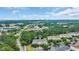 Aerial view of a condo building surrounded by trees and landscaping in a residential neighborhood at 5825 Catalina Dr. # 523, North Myrtle Beach, SC 29582