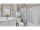 Bathroom featuring a white vanity, toilet, and shower/tub with modern fixtures at 5825 Catalina Dr. # 523, North Myrtle Beach, SC 29582