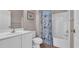 Bathroom with a white vanity, floral shower curtain, and ample space at 5825 Catalina Dr. # 523, North Myrtle Beach, SC 29582