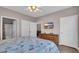 Cozy bedroom with a TV, dresser, and comfortable coastal-themed bedding at 5825 Catalina Dr. # 523, North Myrtle Beach, SC 29582