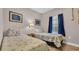 Bedroom featuring two beds, cool-toned colors, and nautical themed decor at 5825 Catalina Dr. # 523, North Myrtle Beach, SC 29582