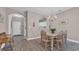 A bright dining area features an arched doorway to the entry way and modern flooring at 5825 Catalina Dr. # 523, North Myrtle Beach, SC 29582
