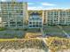 Exterior view of the beachside building with multiple outdoor seating areas and boardwalk at 5825 Catalina Dr. # 523, North Myrtle Beach, SC 29582