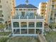 Beachside building with multiple outdoor seating areas and boardwalk access at 5825 Catalina Dr. # 523, North Myrtle Beach, SC 29582