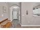 Hallway with wood-look floors, a wooden bench, and charming wall decor at 5825 Catalina Dr. # 523, North Myrtle Beach, SC 29582