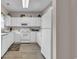 Well-lit kitchen with all-white appliances and ample cabinet space at 5825 Catalina Dr. # 523, North Myrtle Beach, SC 29582
