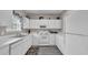 Bright kitchen featuring white cabinets and appliances, with a view of the sink and window at 5825 Catalina Dr. # 523, North Myrtle Beach, SC 29582