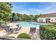 Community pool with lounge chairs, tables, umbrellas and well-maintained landscaping at 5825 Catalina Dr. # 523, North Myrtle Beach, SC 29582