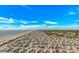 Enjoy a scenic coastal view of the beach, the shoreline, and the blue sea under blue skies at 5905 S Kings Highway # 1106, Myrtle Beach, SC 29575