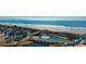 Scenic coastal view with a bridge crossing a pond and the sandy beach in the background at 5905 S Kings Highway # 1106, Myrtle Beach, SC 29575