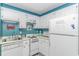Clean kitchen features a sink, stove, microwave and refrigerator at 5905 S Kings Highway # 1106, Myrtle Beach, SC 29575