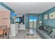 Cozy living room featuring a sofa and balcony access with great views at 5905 S Kings Highway # 1106, Myrtle Beach, SC 29575