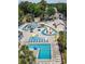 Aerial view of the community pool area featuring lounge chairs and other recreational spaces at 5905 S Kings Highway # 1106, Myrtle Beach, SC 29575