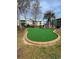 Enjoy a putting green surrounded by mature trees and landscaping at 5905 S Kings Highway # 1106, Myrtle Beach, SC 29575