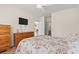Inviting bedroom with wood accents, TV and access to bath and hallway at 6000 Windsor Green Way # 104, Myrtle Beach, SC 29579