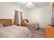 Spacious bedroom featuring two beds and modern wood flooring at 6000 Windsor Green Way # 104, Myrtle Beach, SC 29579