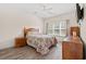 Cozy bedroom with ample light and natural wood furniture at 6000 Windsor Green Way # 104, Myrtle Beach, SC 29579