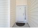 A close-up of a white front door with a window and the number 104 above the door handle at 6000 Windsor Green Way # 104, Myrtle Beach, SC 29579