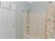 Bright bathroom featuring shower with white tub, shower head, and shower curtain at 6001- 8005 S Kings Hwy., Myrtle Beach, SC 29575