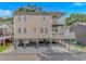 Beach house on stilts with two decks with outdoor furniture and ceiling fans at 6001- 8005 S Kings Hwy., Myrtle Beach, SC 29575