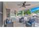 Outdoor porch with ceiling fans and wicker furniture with blue cushions at 6001- 8005 S Kings Hwy., Myrtle Beach, SC 29575