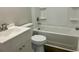 Bathroom features a white vanity, toilet, and tub with white wall surround at 608 Miles Ct, Marion, SC 29571