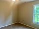 Bedroom with light walls, carpeted floor, ceiling fan, and a window at 608 Miles Ct, Marion, SC 29571