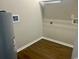 Utility room featuring wooden floor with shelving unit at 608 Miles Ct, Marion, SC 29571