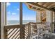 Comfortable balcony featuring seating and ocean views at 618 N Waccamaw Dr. # A-5, Murrells Inlet, SC 29576