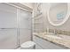 Bathroom features a granite countertop vanity, shower, and round mirror at 618 N Waccamaw Dr. # A-5, Murrells Inlet, SC 29576