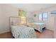 Bright bedroom featuring two beds with patterned linens and coastal-themed decor at 618 N Waccamaw Dr. # A-5, Murrells Inlet, SC 29576