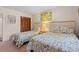 Cozy bedroom with twin beds, closet, and beach-themed artwork at 618 N Waccamaw Dr. # A-5, Murrells Inlet, SC 29576