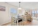 Cozy dining space with table, chairs, and natural light at 618 N Waccamaw Dr. # A-5, Murrells Inlet, SC 29576