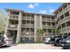 Coastal condo building exterior showcases well-maintained balconies and convenient parking at 618 N Waccamaw Dr. # A-5, Murrells Inlet, SC 29576