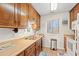 Well-lit kitchen with warm wood cabinets and essential appliances at 618 N Waccamaw Dr. # A-5, Murrells Inlet, SC 29576