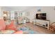 Cozy living room featuring coastal decor, wood floors, and comfortable seating at 618 N Waccamaw Dr. # A-5, Murrells Inlet, SC 29576