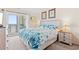 Bright main bedroom with balcony access, and coastal bedding at 618 N Waccamaw Dr. # A-5, Murrells Inlet, SC 29576