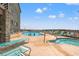 Outdoor community pool and hot tub with lounge chairs for relaxing at 618 N Waccamaw Dr. # A-5, Murrells Inlet, SC 29576